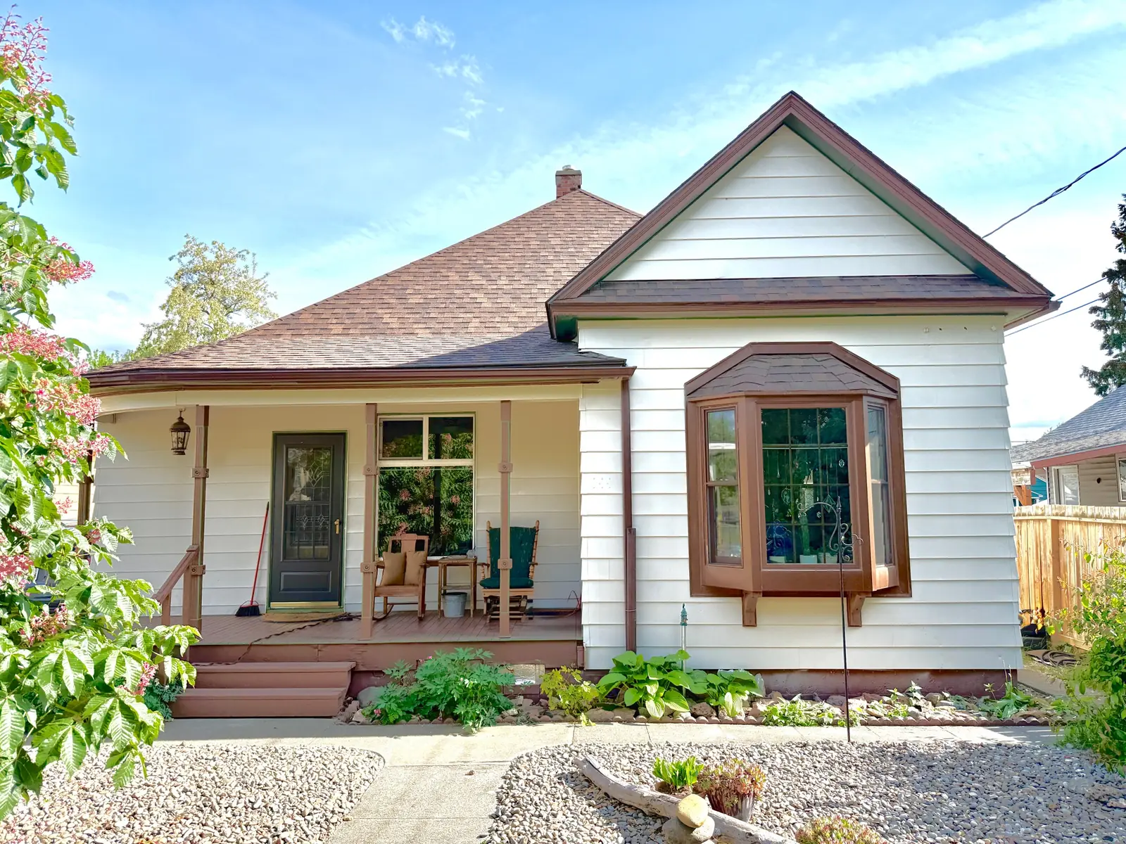 Painter refreshing a home exterior